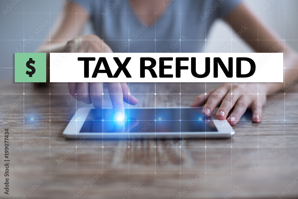 Tax refund text on virtual screen. Business and Finance concept. Tax refund text on virtual screen. Business and Finance concept.