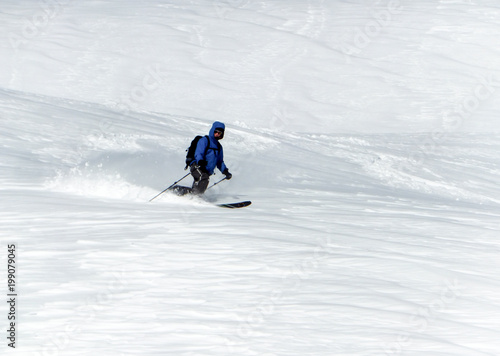 Obraz na plátně male backcountry skier telemark skiing in the Alps in fresh powder