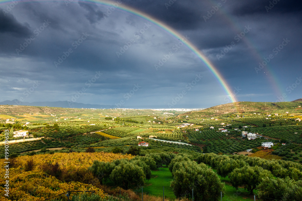 Fototapeta premium Double Rainbow and cultivated land, Greece