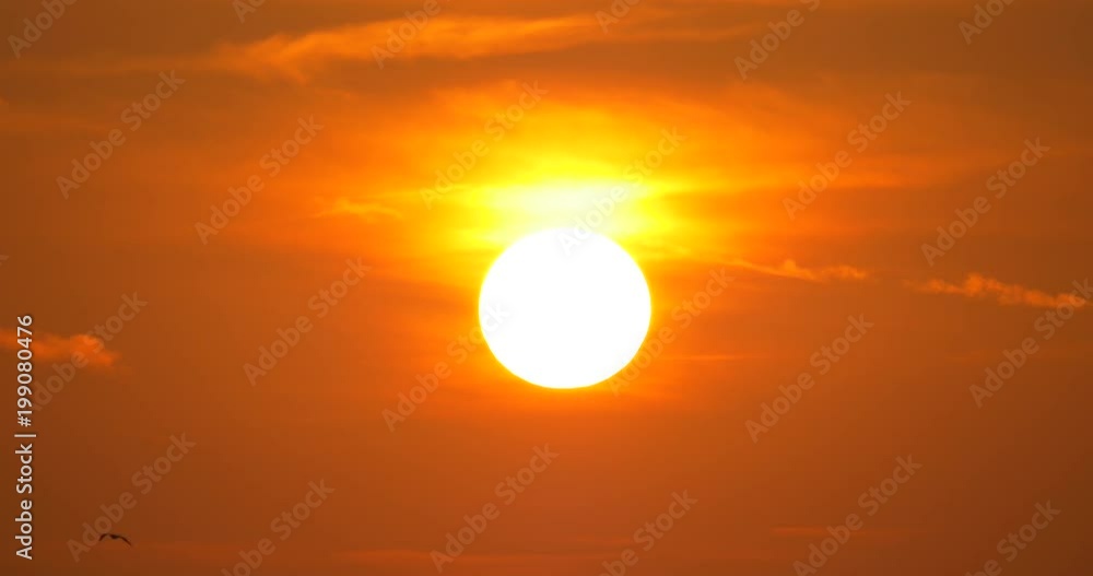 Golden sun on a red sky