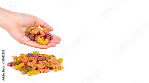 Pasta spiral in hand isolated on white background. copy space, template