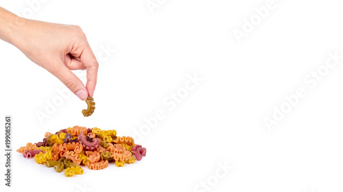 Pasta spiral in hand isolated on white background. copy space, template