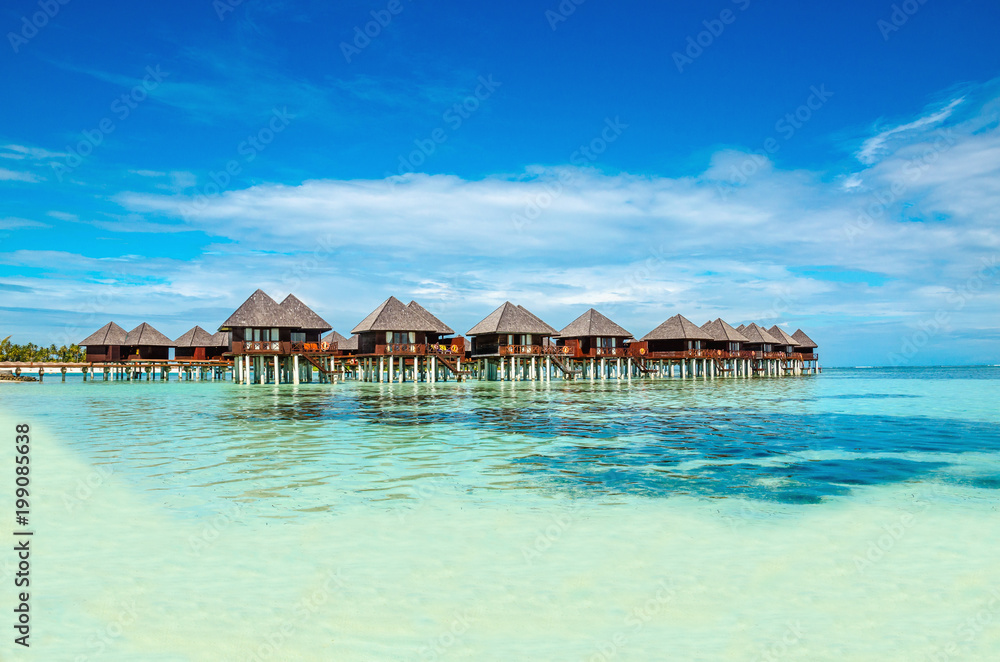 Exotic wooden huts on the water, Maldives