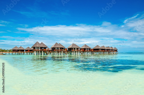 Exotic wooden huts on the water  Maldives