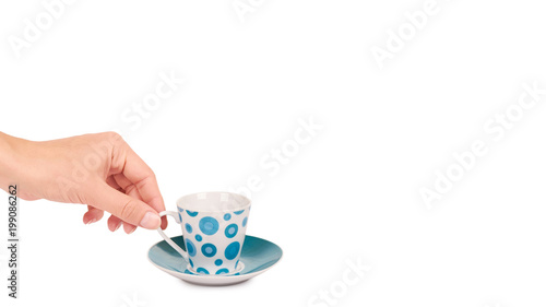 color cup and saucer in hand isolated on white background. copy space, template
