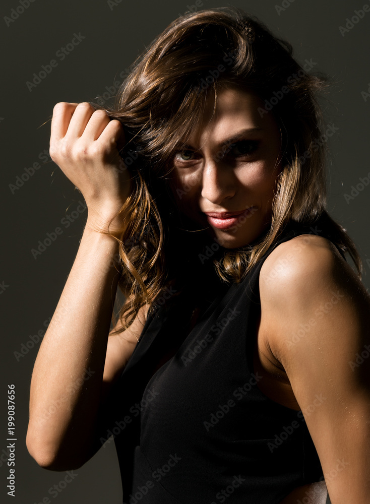 close-up sexy cute businessgirl on a dark background. fashion and make-up, beauty in business close-up sexy cute businessgirl on a dark background. fashion and make-up, beauty in business