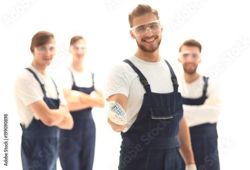 foreman holding out his hand for a handshake