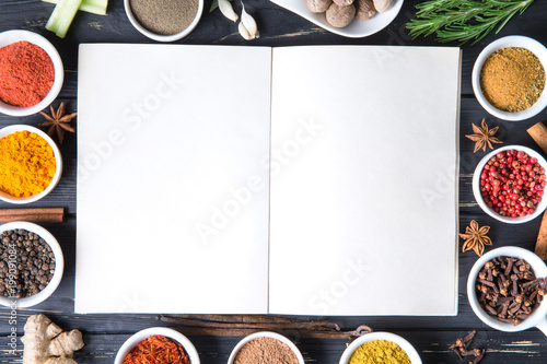 Fototapeta Naklejka Na Ścianę i Meble -  Colorful herbs and spices selection. Aromatic ingredients on wood table