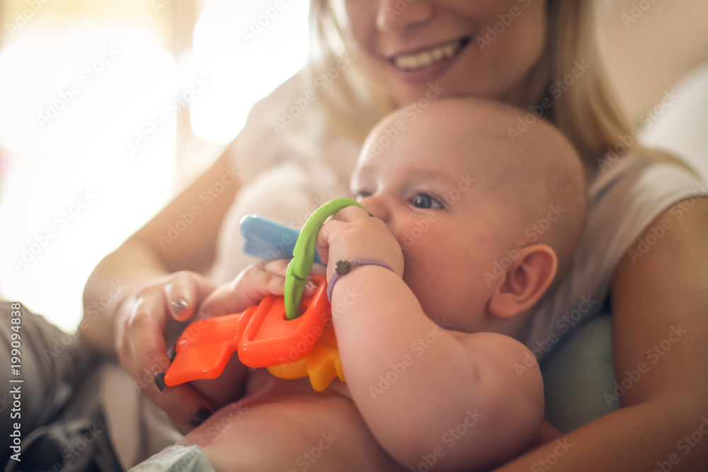 Mother playing with baby boy at home. Close up. Mother playing with baby boy at home. Close up.