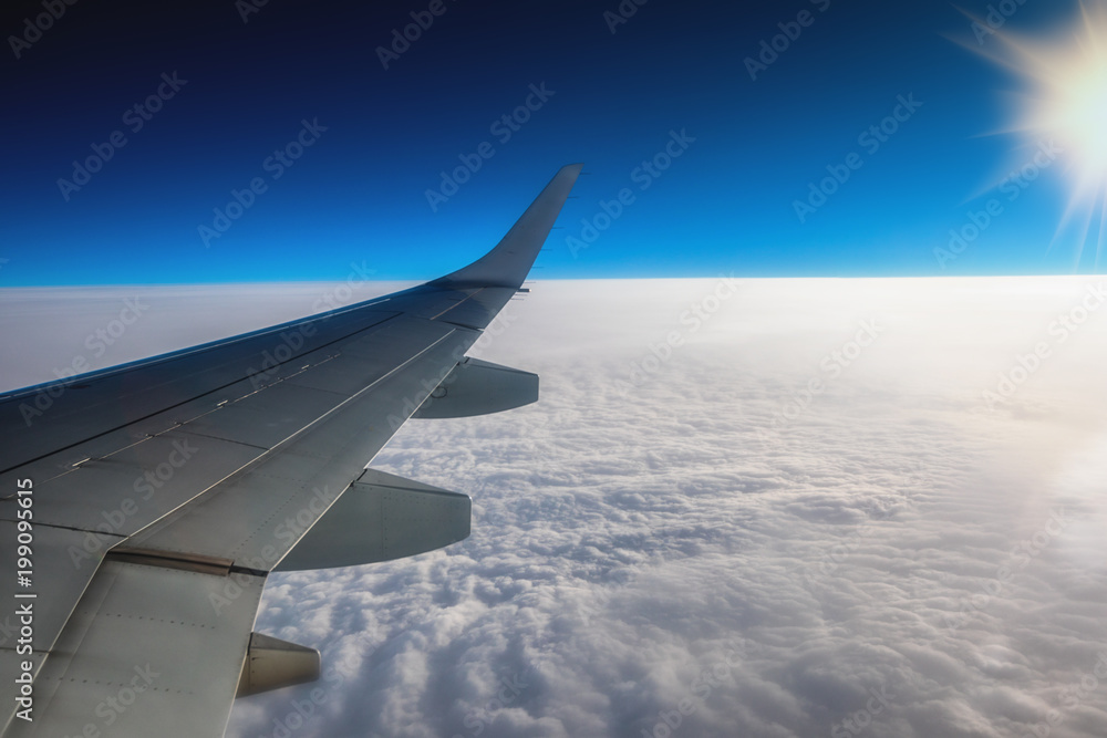 Fototapeta premium View of the airport and airplane wing from the Inside