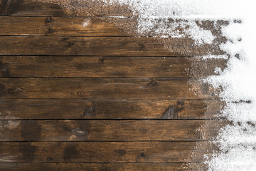 Thaw on the wooden floor terrace in the backyard.