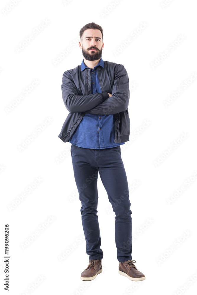 Skeptical suspicious uncertain bearded man with folded hands looking at camera. Full body isolated on white background. Skeptical suspicious uncertain bearded man with folded hands looking at camera. Full body isolated on white background.