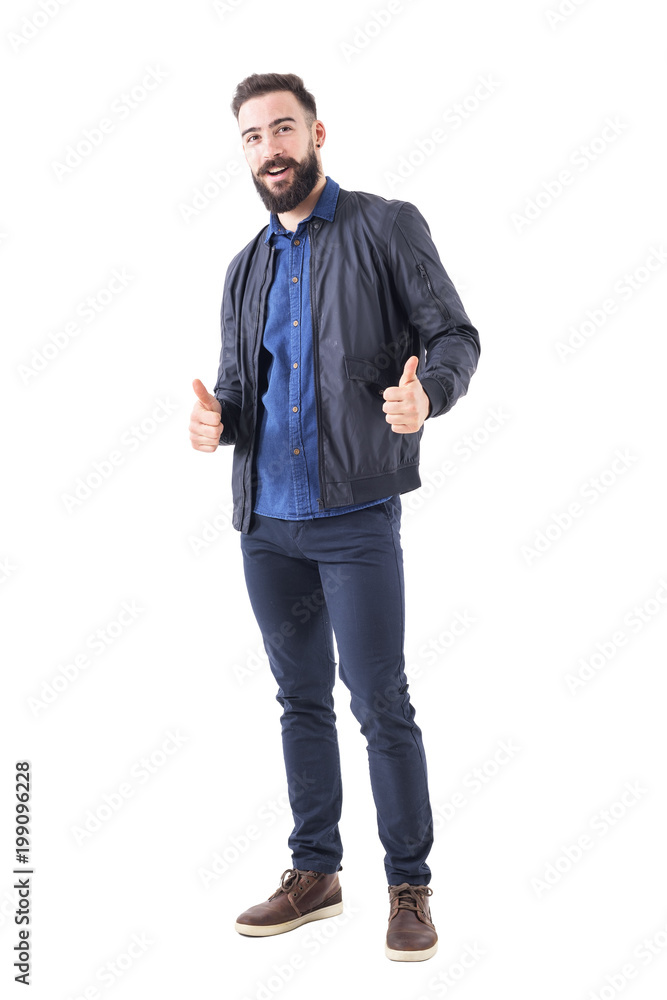 Happy smiling relaxed bearded guy showing thumbs up gesture and looking at camera. Full body length isolated on white background. Happy smiling relaxed bearded guy showing thumbs up gesture and looking at camera. Full body length isolated on white background.
