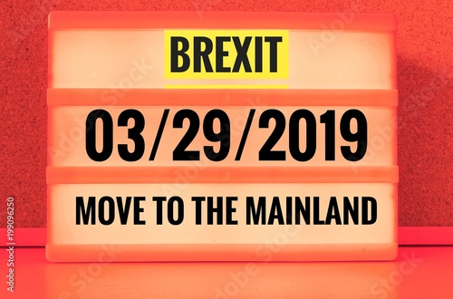 Luminous sign with inscription in english Brexit and 03/29/2019 and move to the mainland, in german 29.03.2019 und zieh aufs Festland, symbolizing the withdrawal of Great Britain from the EU photo