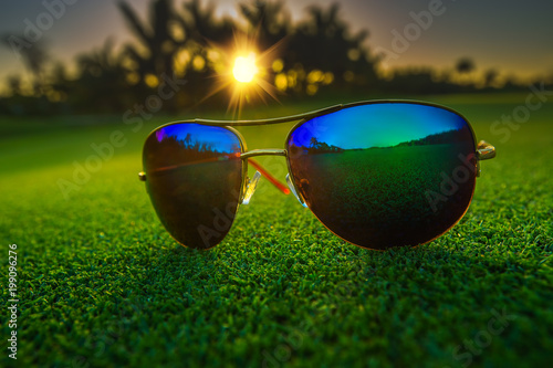 Beautiful fashion sun glasses on golf course