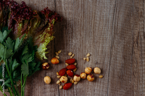 the concept of proper nutrition: nuts, greens - salad and parsley