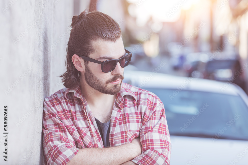 Modern young man posing on the street. Modern young man posing on the street.