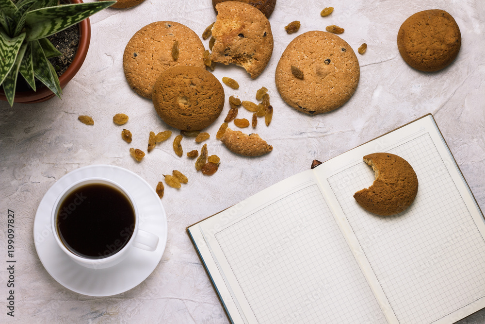 Working weekdays, Cup of coffee, Diary Cookies Flower in a pot on a light background