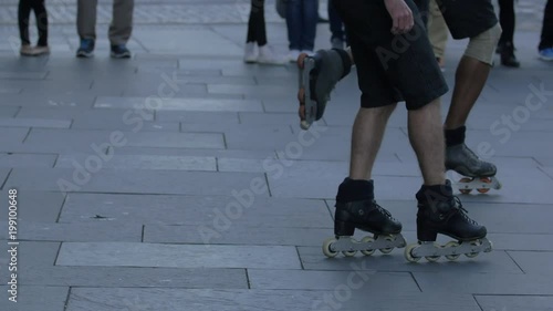 The legs of two roller skaters