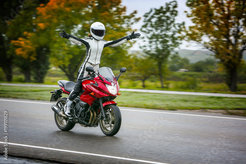 Young girl with a sports motorcycle.