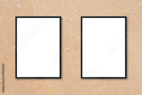 Mock up blank poster picture frame hanging on brown marble wall background in room - can be used mockup for montage products display and design key visual layout.