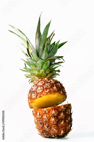 Fresh juicy pineaplle flying on white background photo