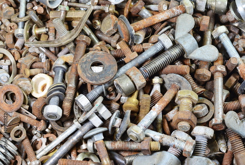 Background from old rusty bolts, screws, nuts, screws, brackets, various metal details