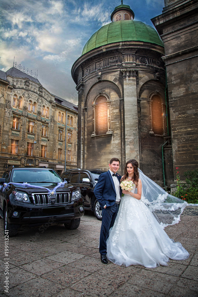 Wedding couple on background of ancient architecture of Lviv Wedding couple on background of ancient architecture of Lviv