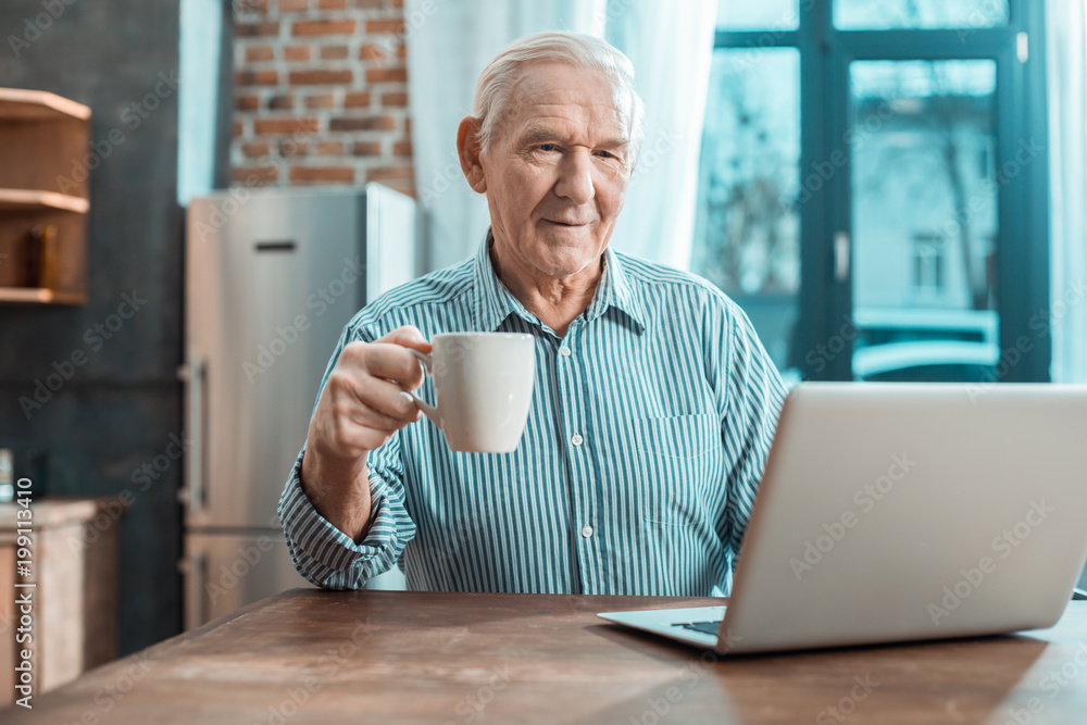Nice elderly man having tea Nice elderly man having tea
