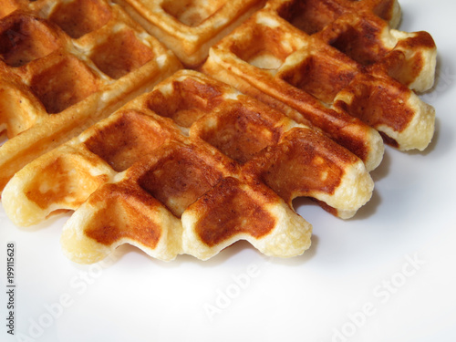 Homemade Belgian waffles on white plate