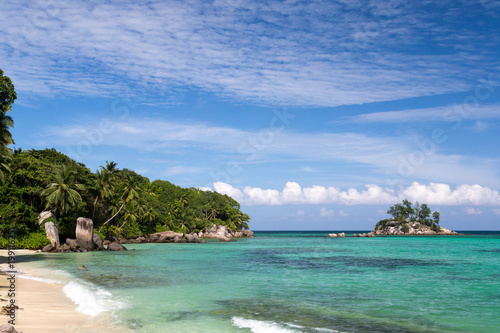 Fototapeta Naklejka Na Ścianę i Meble -  Beautiful beach with a small island in the near, Seychelles