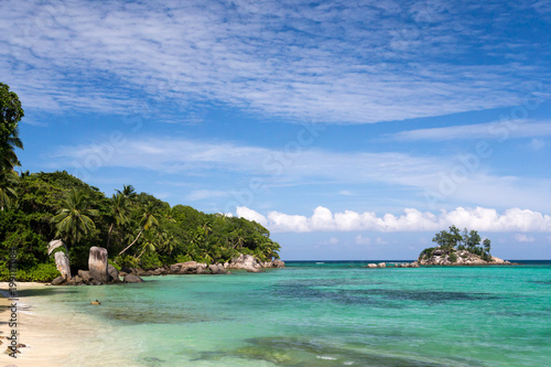 Beautiful beach with a small island in the near, Seychelles