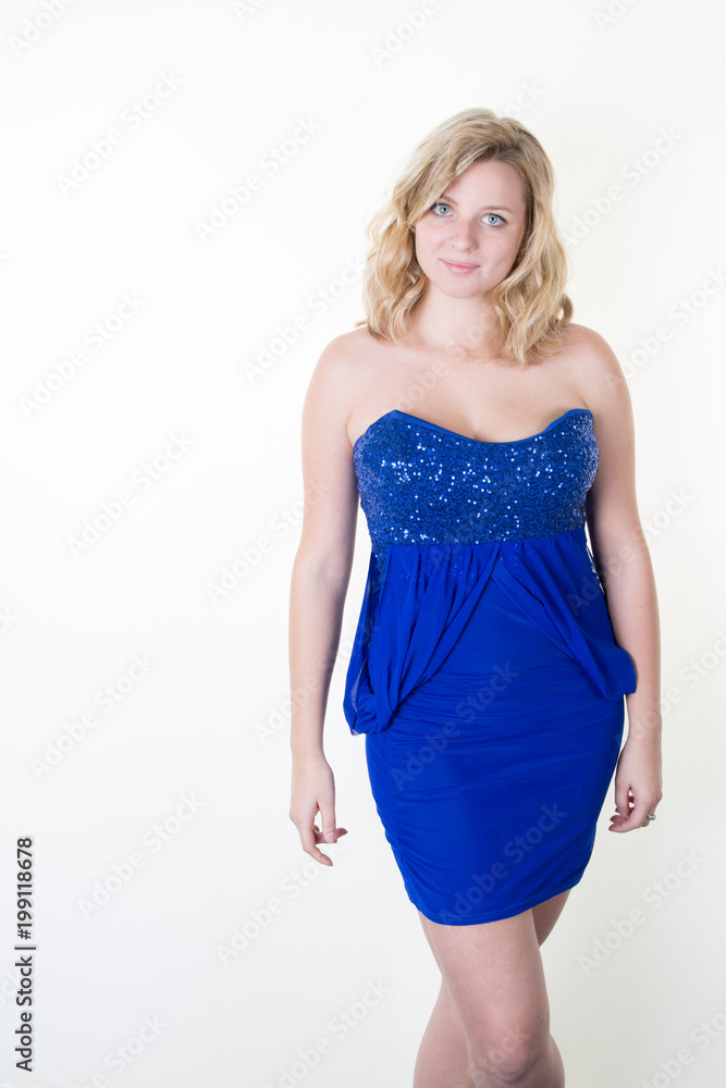 Portrait of beautiful model in blue dress with blond shoulders Portrait of beautiful model in blue dress with blond shoulders