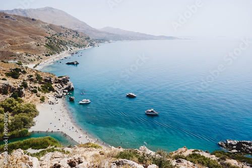 Panorama of Preveli palm beach at Libyan sea, turquoise bay with ships and mountains , Crete , Greece © Olesia