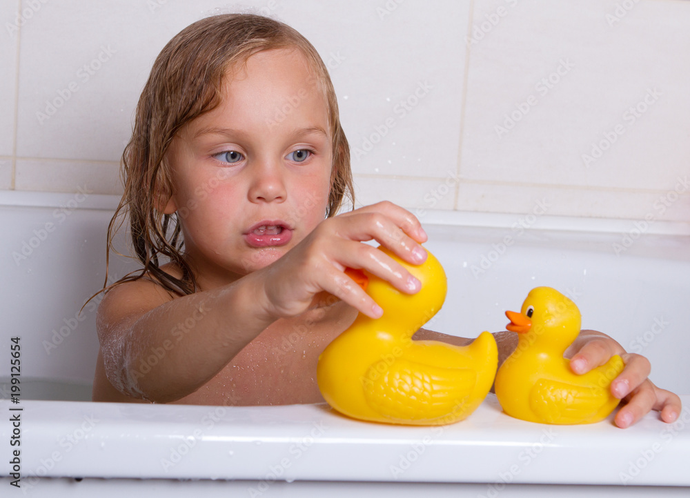 baby girl taking bath with foam baby girl taking bath with foam