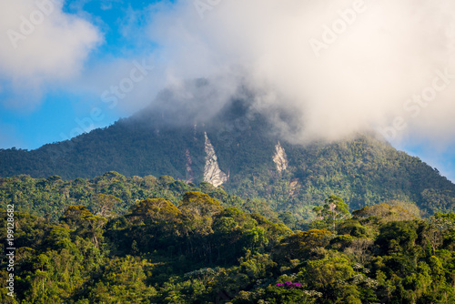 Montanha encoberta pela Mata Atlântica e nuvens na Serra do Caparaó, Espírito Santo, Brasil. photo