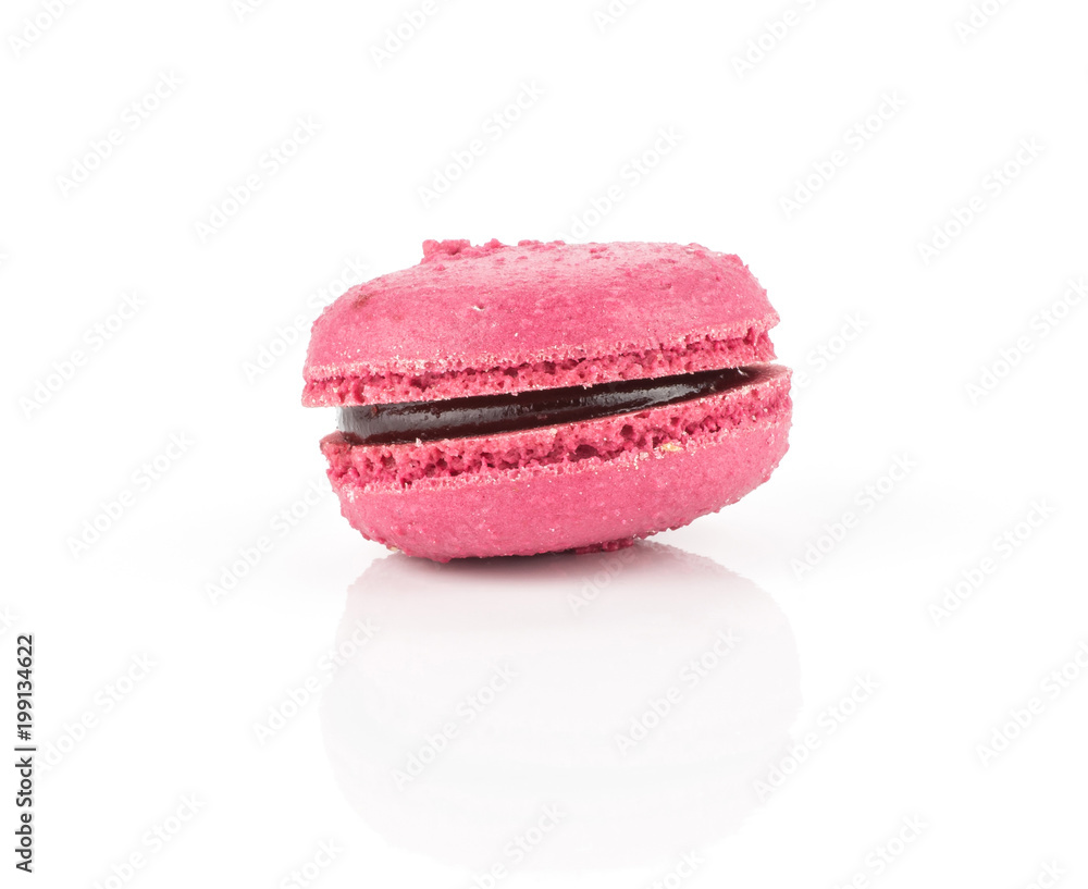 Pink French macaron isolated on white background one with raspberry jam. Pink French macaron isolated on white background one with raspberry jam.