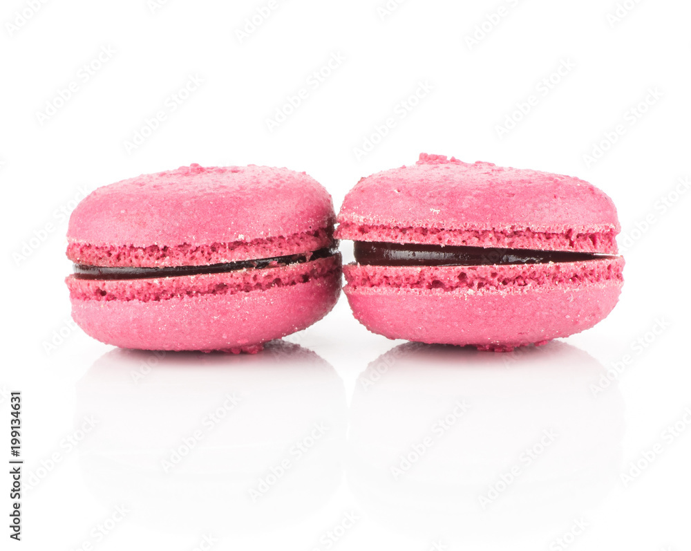 Pink French macarons isolated on white background two with raspberry jam. Pink French macarons isolated on white background two with raspberry jam.