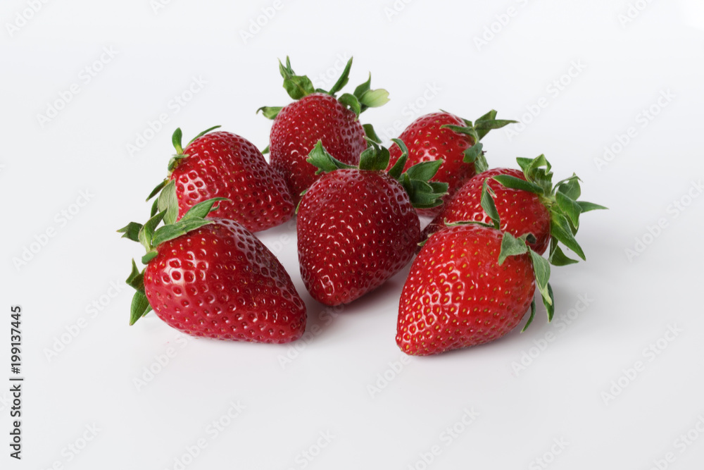Closeup shot of fresh strawberries. Isolated on white background Closeup shot of fresh strawberries. Isolated on white background