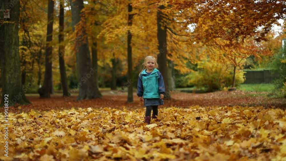 Girl Running on Orange Autumn Leaves in Slow Motion Girl Running on Orange Autumn Leaves in Slow Motion