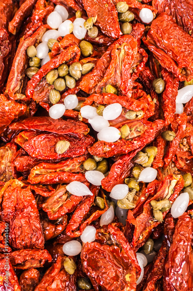 sun dried tomatoes with tuscany oil, white little onions and green salty capers sun dried tomatoes with tuscany oil, white little onions and green salty capers