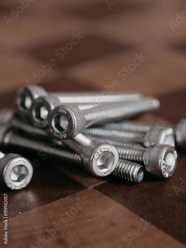 Pile of insex screw on wood photo