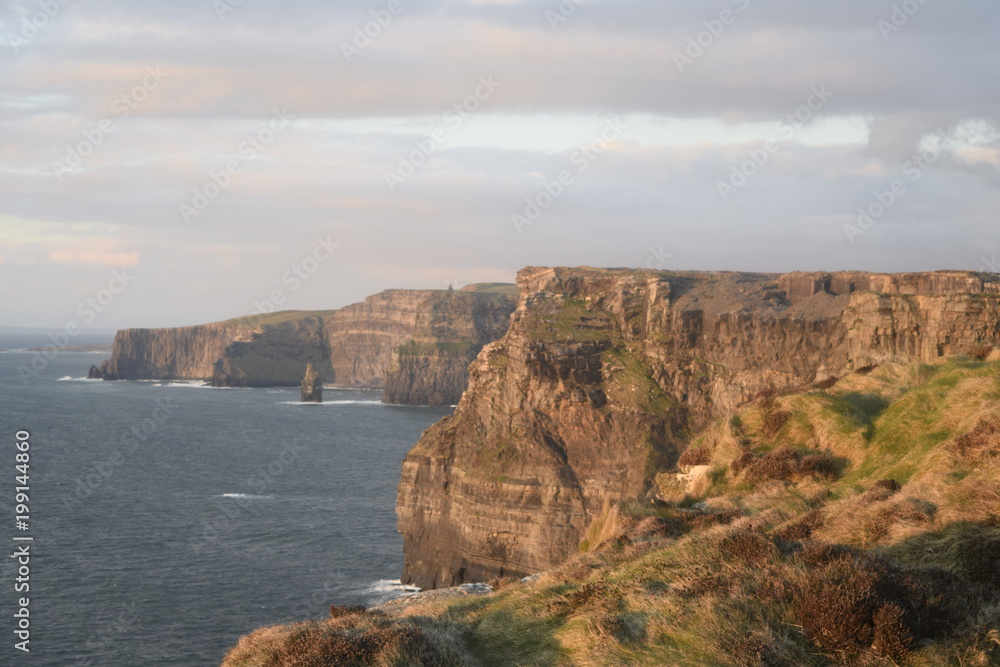 Cliffs of Moher, County Clare, Ireland. Views of coastline. Sunset.