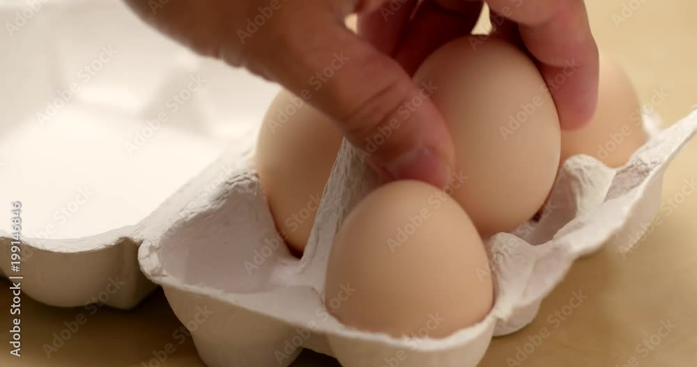 Picking egg from pack Picking egg from pack