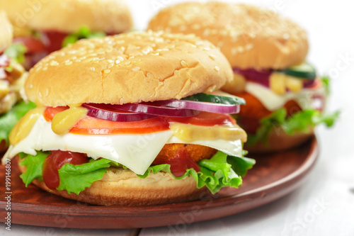 Fast food, homemade burger on a wooden background