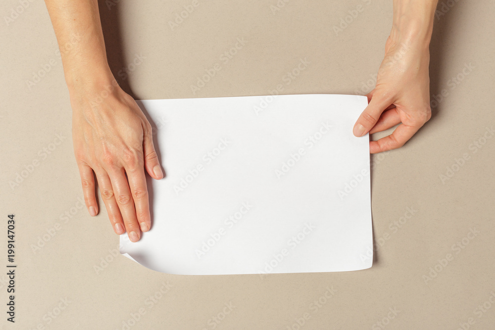 Hand holding papers a4 size Hand holding papers a4 size