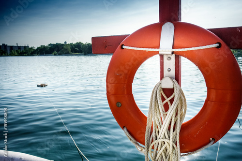 Canvas Print Lifebuoy hanging on boat
