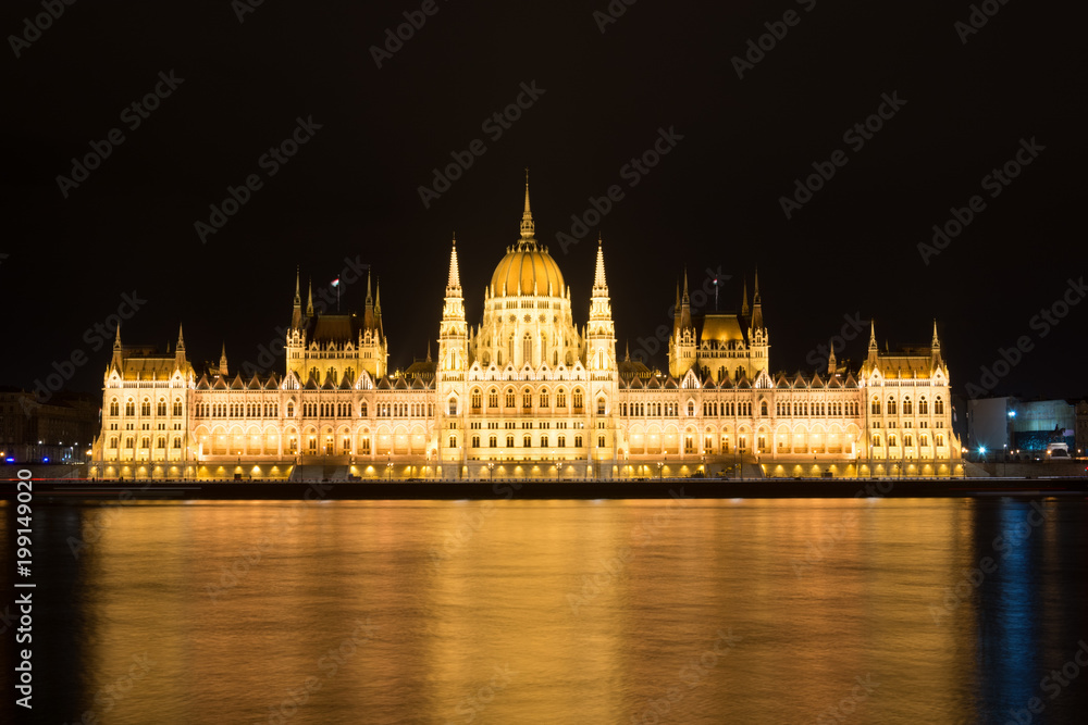 Famous Budapest parliament at the river Danube at night from the front