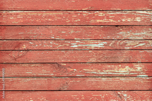 Peeled painted boards in red