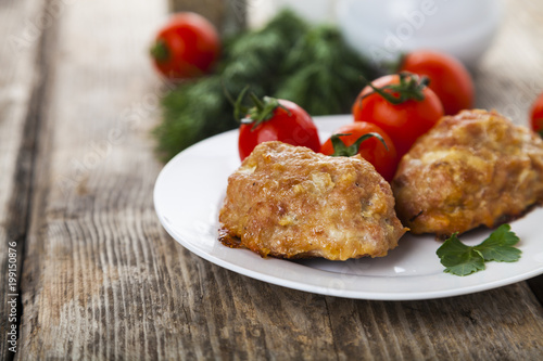 Delicious cutlets, tomatoes and parsley